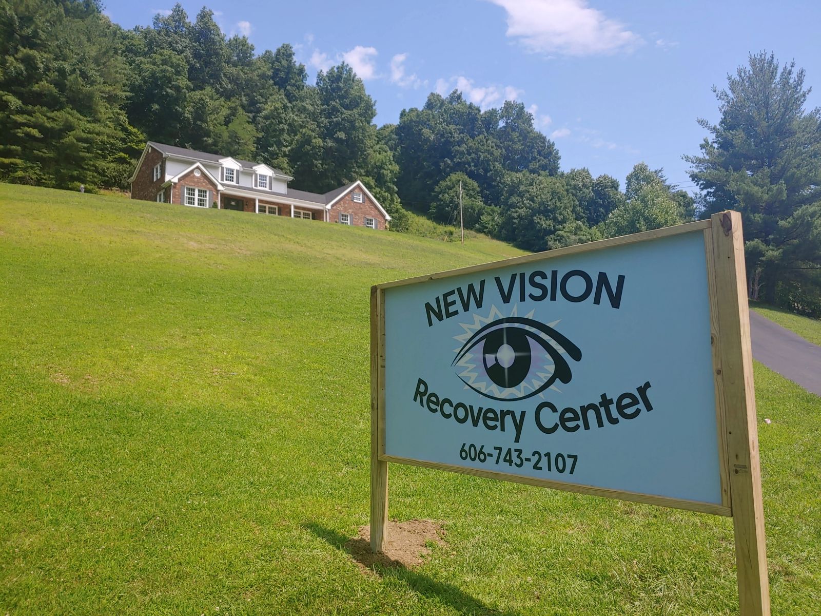 New Vision Recovery Center sign on the lawn below the residence in West Liberty, Kentucky