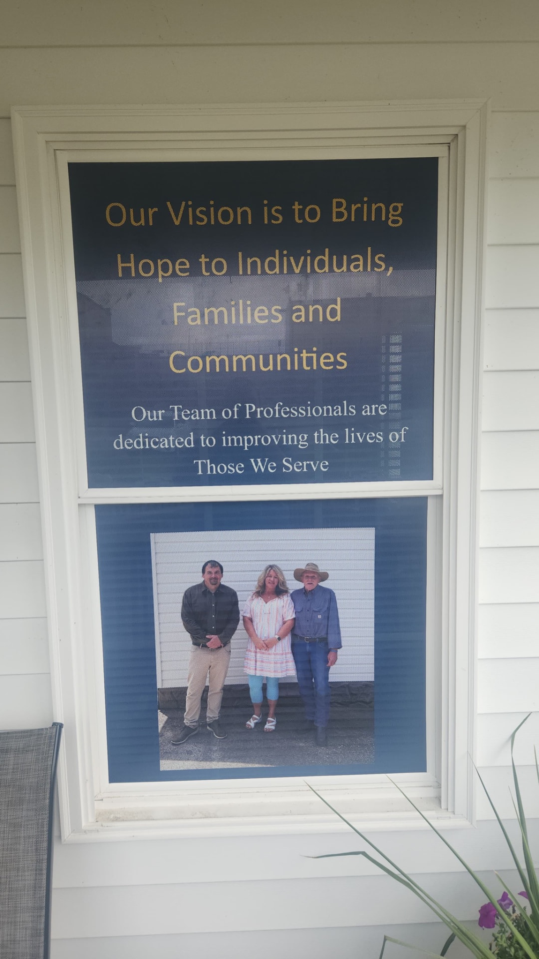 Our Vision sign at New Vision Recovery Center with leadership photo